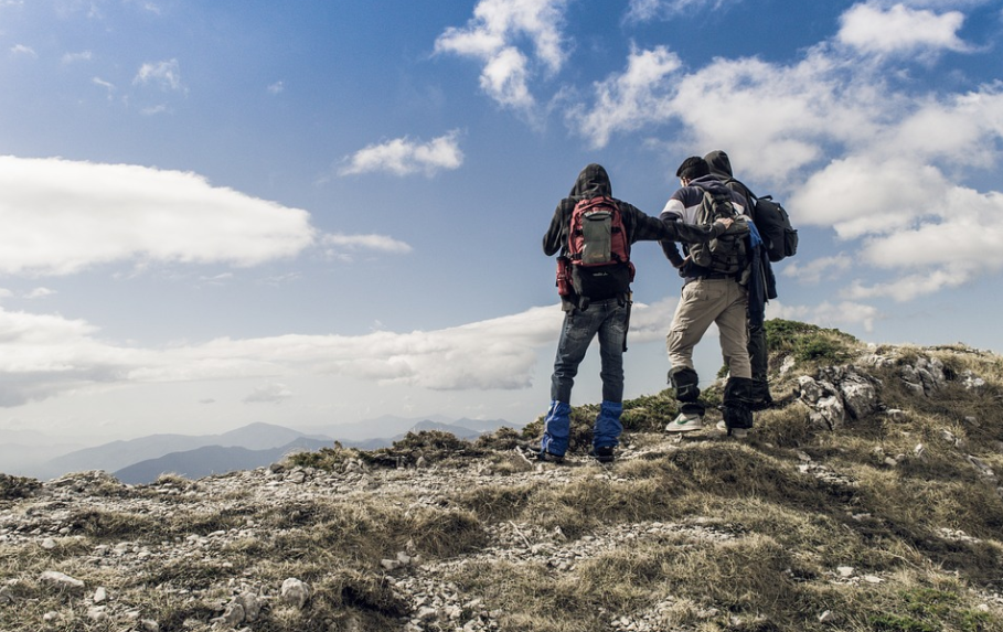 travelers using a backpack